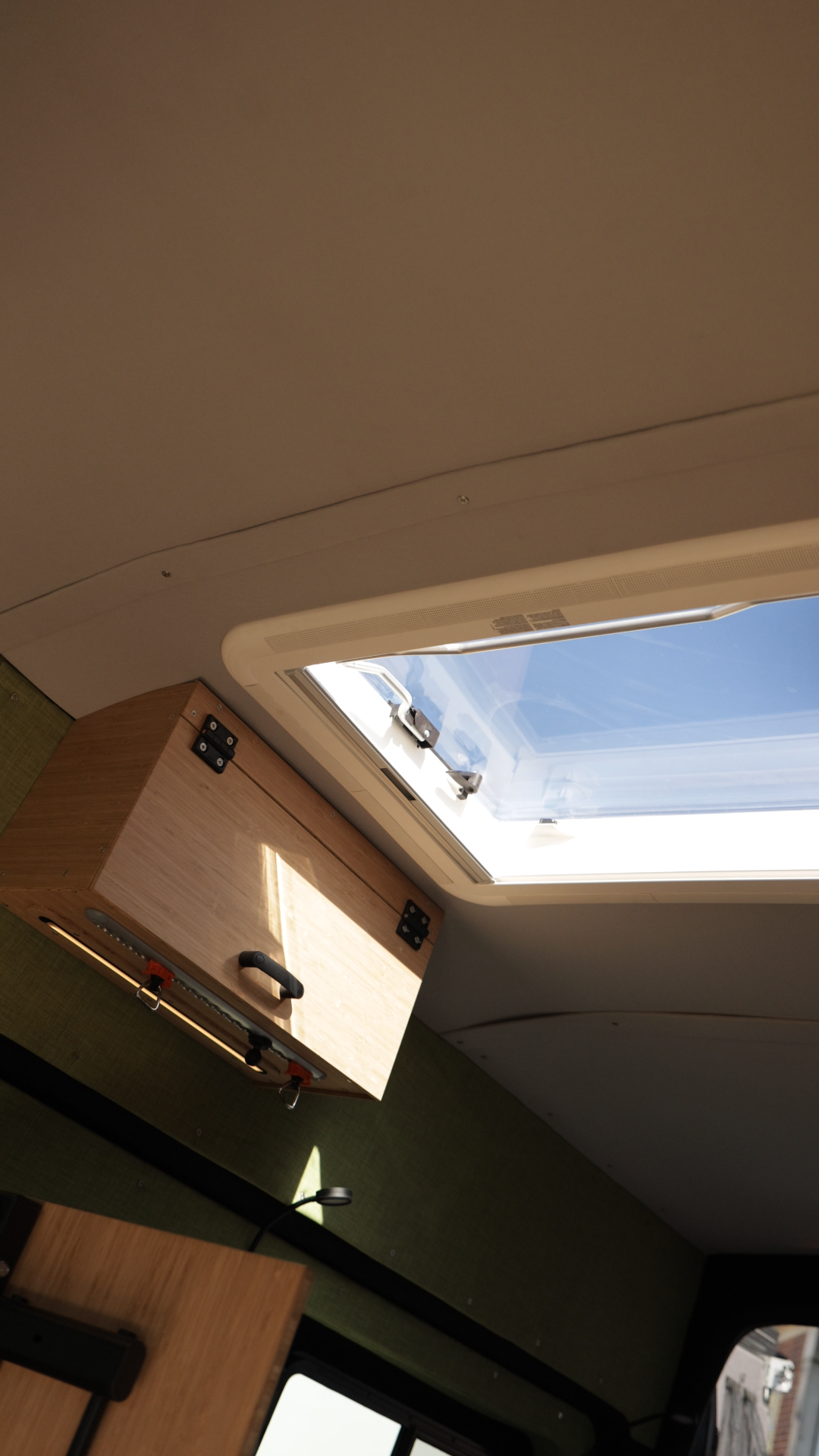 Roof skylight window inside a custom campervan conversion by JCC Customs